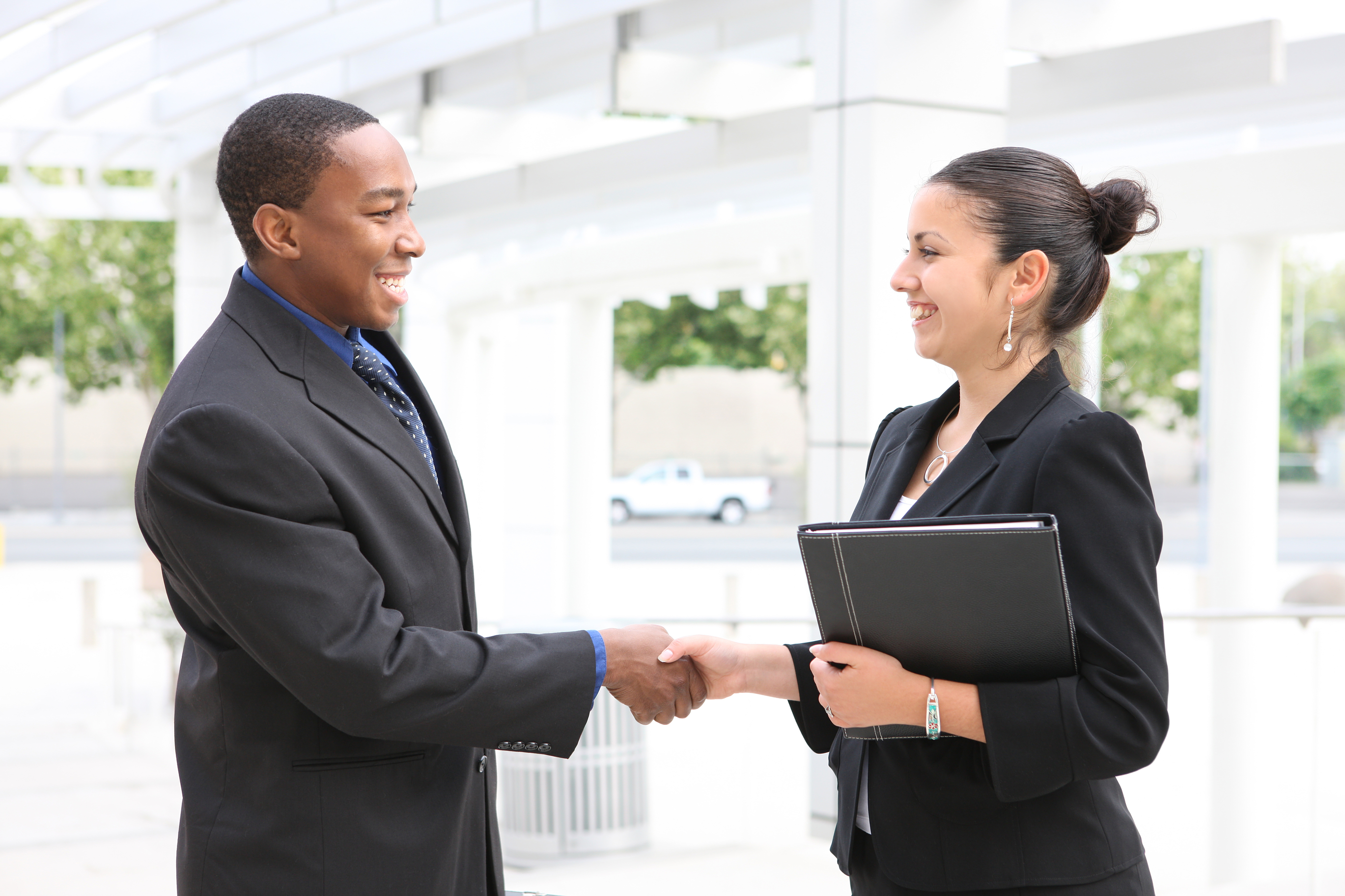man and woman shaking hands